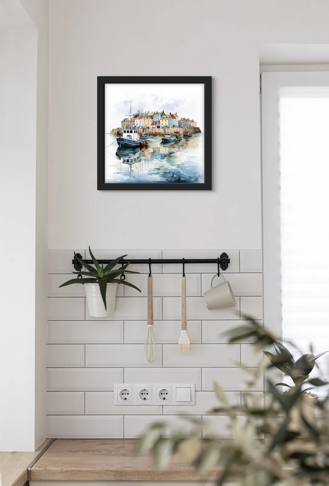 Watercolour of a harbour with boats and quaint houses reflecting in the water.
