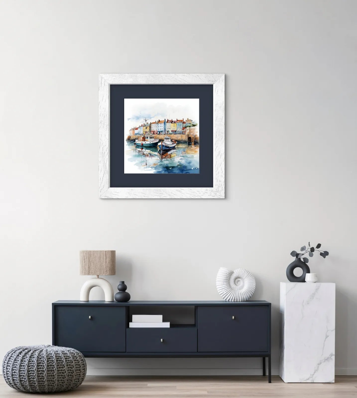 Watercolour painting of boats docked at a harbour with colourful houses in the background.