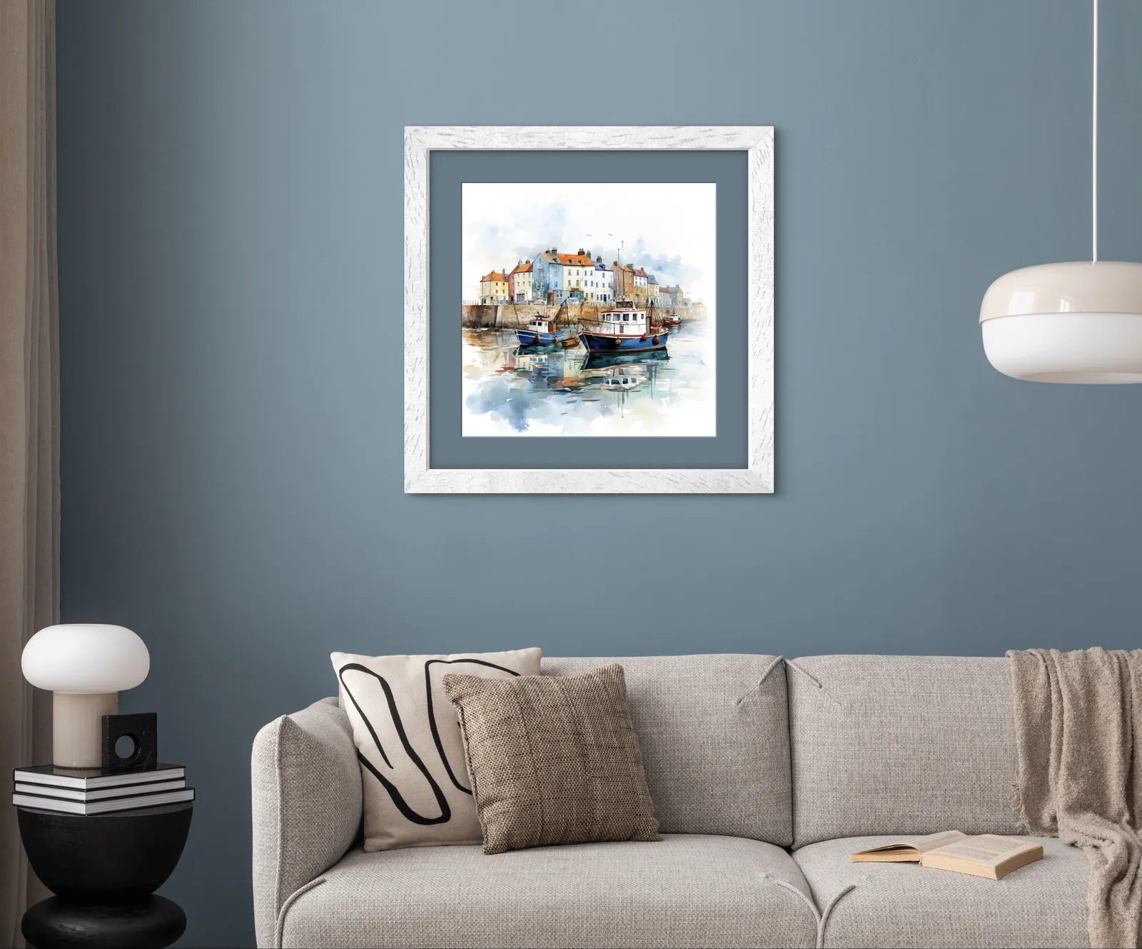 Watercolour painting of a coastal village with moored boats.