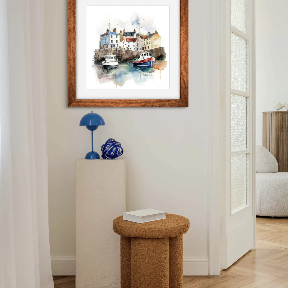 Watercolour painting of a harbour with boats and colourful cottages.