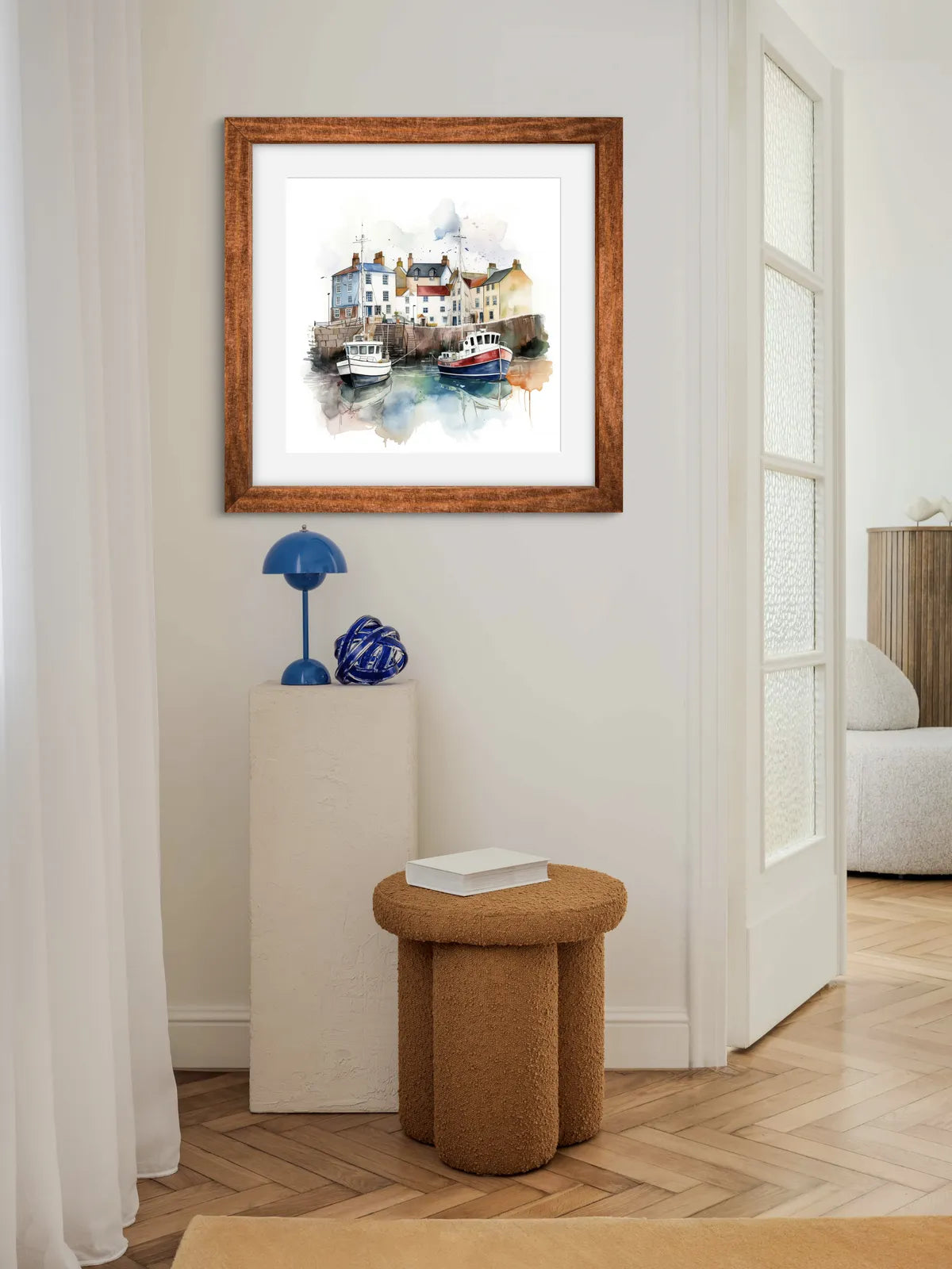 Watercolour painting of a harbour with boats and colourful cottages.