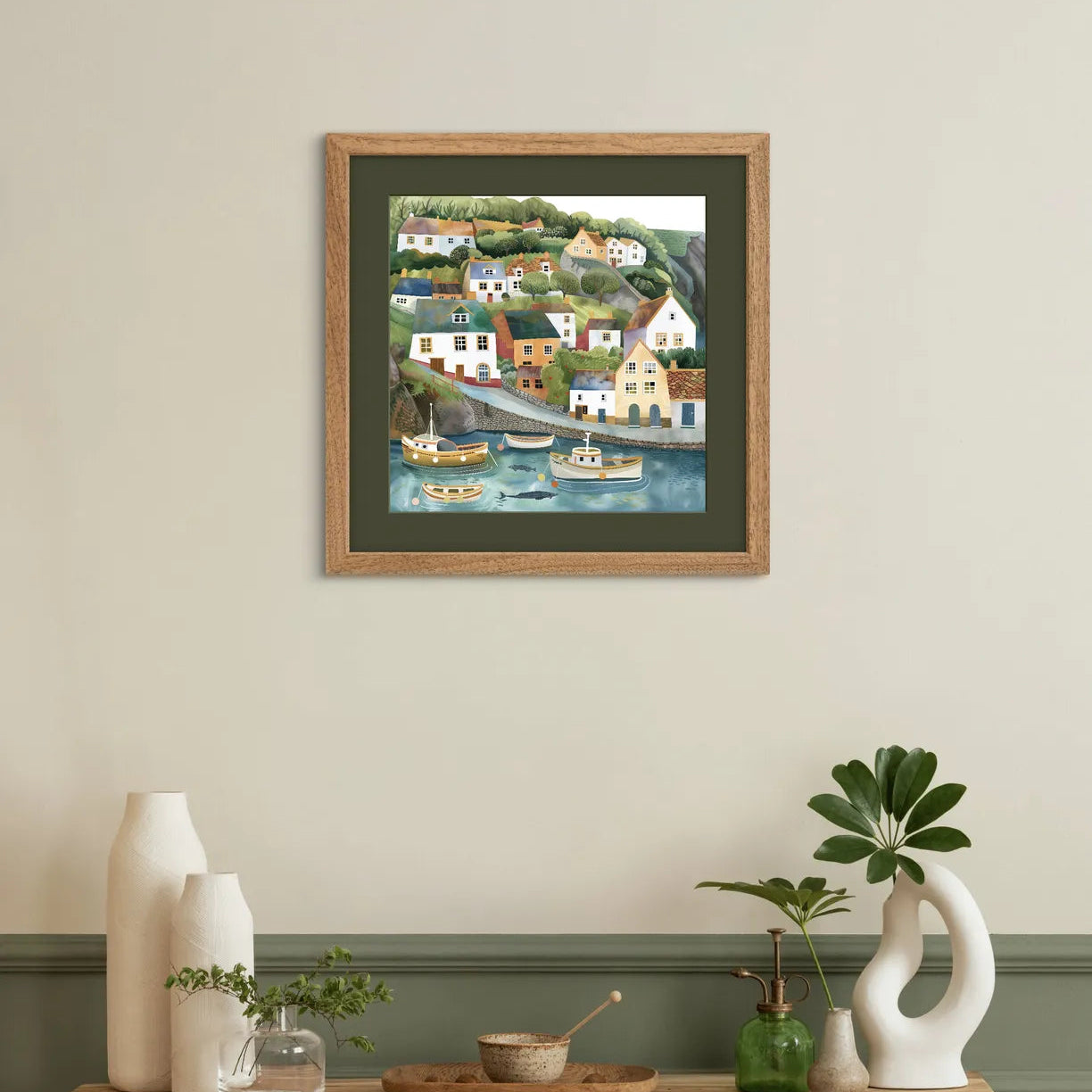 Art print depicting a colourful coastal village with boats in the harbour.