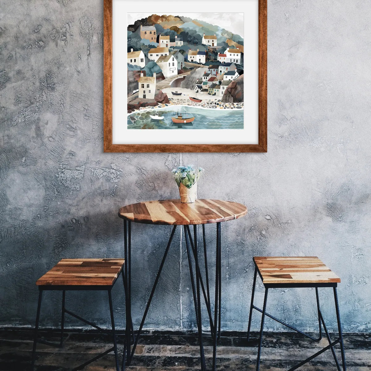 Art print of a coastal village with houses, boats, and soft pastel colours.