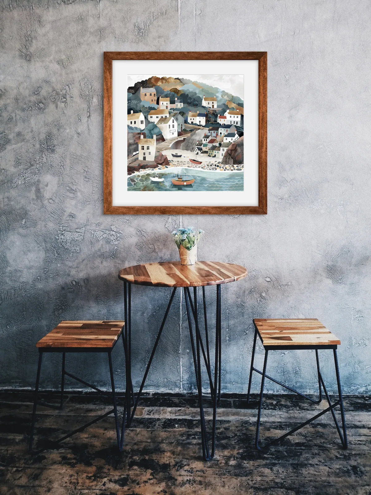 Art print of a coastal village with houses, boats, and soft pastel colours.