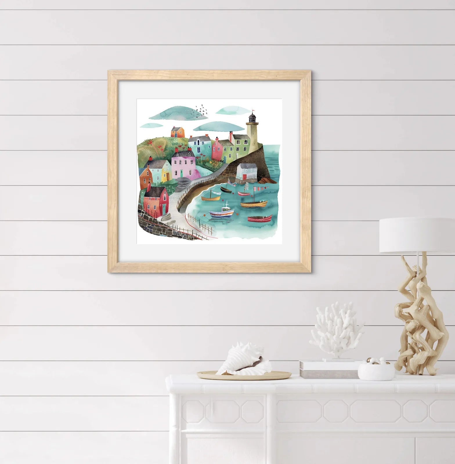Illustration of a vibrant seaside village with colourful houses and boats in a harbour.